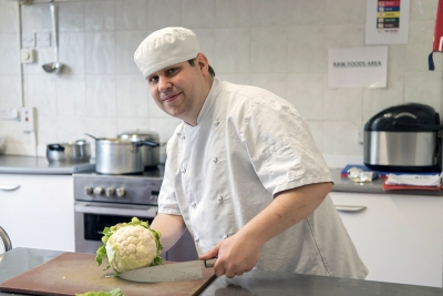 cook preparing food in kitchen